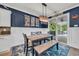 Cozy dining room adjacent to the kitchen with sliding glass doors to an outdoor patio at 1009 Oak Marsh Ln., North Myrtle Beach, SC 29582