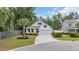 Charming two-story home with a well-manicured lawn, red door, and attached garage at 1009 Oak Marsh Ln., North Myrtle Beach, SC 29582