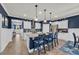 Bright, open kitchen with an island, stainless steel appliances, and ample seating at 1009 Oak Marsh Ln., North Myrtle Beach, SC 29582