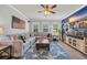 This living room features a gray sectional, coastal decor, and a large blue starfish rug at 1009 Oak Marsh Ln., North Myrtle Beach, SC 29582