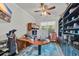 Spacious home office with custom desk, vaulted ceiling, a window and built in shelves at 1009 Oak Marsh Ln., North Myrtle Beach, SC 29582