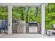 Charming outdoor area featuring a built-in grill station with stainless steel appliances at 1009 Oak Marsh Ln., North Myrtle Beach, SC 29582