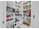 Well-organized pantry with ample shelving providing convenient storage for kitchen essentials at 1009 Oak Marsh Ln., North Myrtle Beach, SC 29582