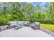 Relaxing outdoor patio with comfortable wicker furniture and serene wooded views at 1009 Oak Marsh Ln., North Myrtle Beach, SC 29582