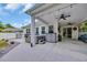Covered outdoor patio with built in hot tub, lighting, ceiling fans and outdoor furniture at 1009 Oak Marsh Ln., North Myrtle Beach, SC 29582