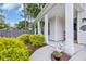 Inviting front porch featuring lush landscaping and decorative touches for a warm welcome at 1009 Oak Marsh Ln., North Myrtle Beach, SC 29582