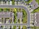 Aerial view of the house in a neighborhood with mature trees and landscaping on an overcast day at 1065 Harvester Circle, Myrtle Beach, SC 29579