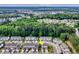 Aerial view of residential neighborhood near a shopping center, the Atlantic Ocean and mature trees at 1065 Harvester Circle, Myrtle Beach, SC 29579