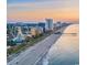 Breathtaking aerial view of the coastline featuring pristine beaches, high-rise buildings and a scenic pier at 1065 Harvester Circle, Myrtle Beach, SC 29579