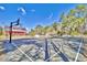 Well-maintained outdoor basketball court surrounded by lush trees, perfect for sports and recreation at 1065 Harvester Circle, Myrtle Beach, SC 29579