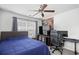 Cozy bedroom featuring a large bed, ceiling fan, natural light, and modern decor for a relaxing and comfortable space at 1065 Harvester Circle, Myrtle Beach, SC 29579