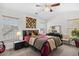 Inviting bedroom with a patterned bed, warm lighting, and large windows providing natural light, creating a peaceful retreat at 1065 Harvester Circle, Myrtle Beach, SC 29579