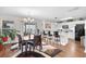 Open dining area with bar seating, pendant lights, and plenty of natural light at 1065 Harvester Circle, Myrtle Beach, SC 29579