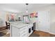 Kitchen featuring granite countertops, stainless steel sink, and white cabinets at 1065 Harvester Circle, Myrtle Beach, SC 29579