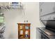 Well-organized laundry room with stacked washer/dryer, storage cabinet, and shelving for optimal space-saving and storage solutions at 1065 Harvester Circle, Myrtle Beach, SC 29579