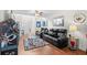 Comfortable living room with plush seating, arcade game, and natural light at 1065 Harvester Circle, Myrtle Beach, SC 29579