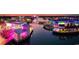 Vibrant night view showcasing waterfront dining and entertainment district with colorful lights reflecting on water at 1065 Harvester Circle, Myrtle Beach, SC 29579