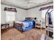Bedroom featuring a wood bed frame, wood floors, and vintage-style wallpaper border accents at 1104 Ragin St., Myrtle Beach, SC 29577