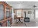 A cozy dining room featuring a wood table, cabinet, chandelier and a unique wood stove at 1104 Ragin St., Myrtle Beach, SC 29577