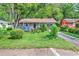 Charming single-story home with a well-maintained lawn and mature trees providing shade and curb appeal at 1104 Ragin St., Myrtle Beach, SC 29577