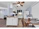 Bright kitchen features white cabinets, modern appliances, and an adjacent dining area with a round wooden table at 1104 Ragin St., Myrtle Beach, SC 29577