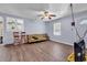 Inviting living room with wood-look floors, a ceiling fan, and natural light from the windows at 1104 Ragin St., Myrtle Beach, SC 29577