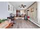Charming living room with wood floors, a wood burning stove, and a raised dining area at 1104 Ragin St., Myrtle Beach, SC 29577