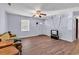 Spacious living room with wood-look floors, neutral paint, and a ceiling fan at 1104 Ragin St., Myrtle Beach, SC 29577