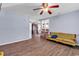 Bright living room with wood-look floors, light blue walls, and a glimpse into the open kitchen at 1104 Ragin St., Myrtle Beach, SC 29577