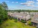 Aerial view of townhome property with lush landscaping and well-maintained lawns at 112 Olde Towne Way # 5, Myrtle Beach, SC 29588