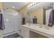 Well-lit bathroom features a glass-enclosed shower and a vanity with ample counter space at 112 Olde Towne Way # 5, Myrtle Beach, SC 29588