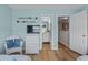 Bedroom with light blue walls, white wicker furniture, and entrances to hall and bathroom at 112 Olde Towne Way # 5, Myrtle Beach, SC 29588