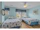 Charming bedroom with seashell themed decor, featuring two twin beds and natural light at 112 Olde Towne Way # 5, Myrtle Beach, SC 29588