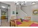Dining area with wooden table and seating for four, adjacent to the kitchen and stairs at 112 Olde Towne Way # 5, Myrtle Beach, SC 29588