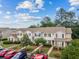 View of the exterior of multi-Gathering townhomes with parking available to tenants at 112 Olde Towne Way # 5, Myrtle Beach, SC 29588