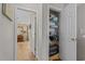 Open linen closet in hallway with a view of a large dresser at 112 Olde Towne Way # 5, Myrtle Beach, SC 29588
