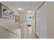 Upstairs hallway boasts beach themed art and closet with a view of the bedroom at 112 Olde Towne Way # 5, Myrtle Beach, SC 29588