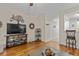Comfortable living room with hardwood floors, TV, and stylish decor at 112 Olde Towne Way # 5, Myrtle Beach, SC 29588
