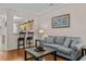 Living area with hardwood floors, neutral sofa and a view of the kitchen at 112 Olde Towne Way # 5, Myrtle Beach, SC 29588
