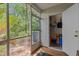 View of screened porch with outdoor storage and access to backyard at 112 Olde Towne Way # 5, Myrtle Beach, SC 29588