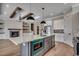 Contemporary kitchen with island, stainless appliances, custom cabinets, beams, and modern lighting at 1142 Fiddlehead Way, Myrtle Beach, SC 29579