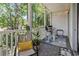 Outdoor balcony area perfect for relaxation, with chairs and views of surrounding greenery at 1290 River Oaks Dr. # 7H, Myrtle Beach, SC 29579