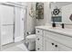 Nautical themed bathroom with a walk-in shower and white vanity at 1290 River Oaks Dr. # 7H, Myrtle Beach, SC 29579