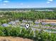 Aerial view of the residential community surrounded by lush greenery, showcasing its serene setting at 1290 River Oaks Dr. # 7H, Myrtle Beach, SC 29579