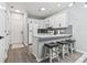 Bright, modern kitchen with white cabinets, stainless steel appliances, and bar seating at 1290 River Oaks Dr. # 7H, Myrtle Beach, SC 29579