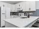 Modern kitchen with white cabinets, stainless steel appliances, and light countertops at 1290 River Oaks Dr. # 7H, Myrtle Beach, SC 29579