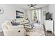 Comfortable living room with plush seating and a balcony view at 1290 River Oaks Dr. # 7H, Myrtle Beach, SC 29579