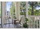 Cozy screened porch with relaxing outdoor seating at 1290 River Oaks Dr. # 7H, Myrtle Beach, SC 29579