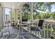 Inviting screened porch with comfortable seating area at 1290 River Oaks Dr. # 7H, Myrtle Beach, SC 29579