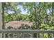 Wooded backyard view from the screened porch at 1290 River Oaks Dr. # 7H, Myrtle Beach, SC 29579